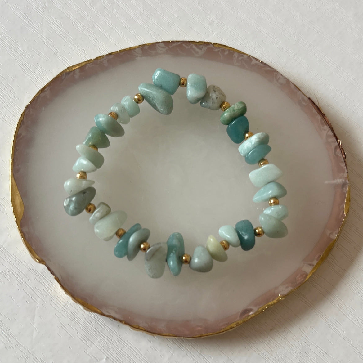 Amazonite crystal chip bracelet on rose quartz tray