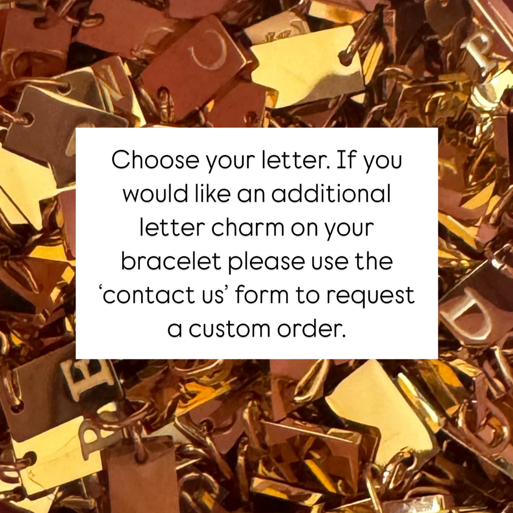 
                      
                        Gold Plated Engraved Initial Tag Bracelet - Positively Beaded
                      
                    