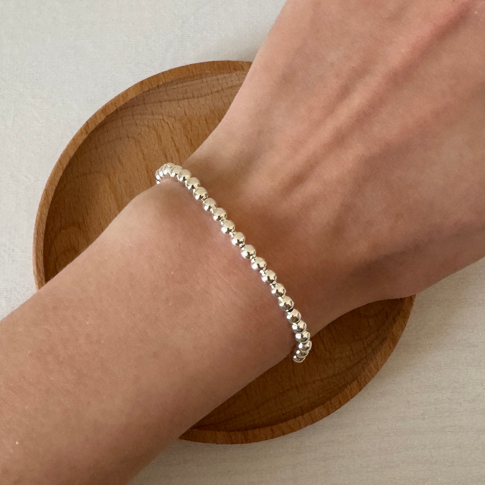 
                      
                        Simple silver beaded bracelet
                      
                    