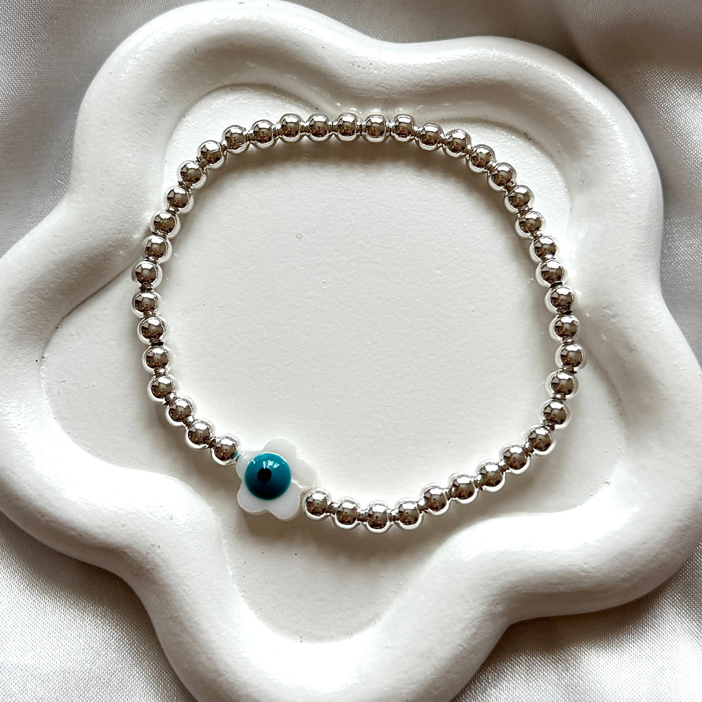 
                      
                        Evil eye pearl flower bracelet - Positively Beaded
                      
                    
