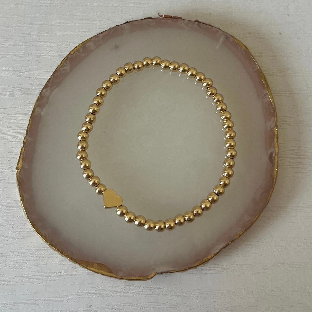 
                      
                        Simple gold heart bracelet
                      
                    