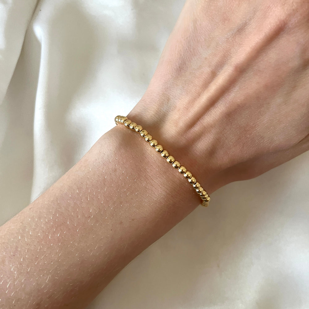 
                      
                        Simple gold beaded bracelet
                      
                    