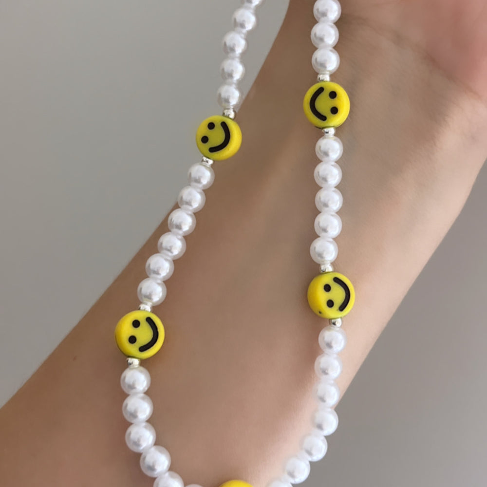 
                      
                        Beaded phone strap - smile and pearl
                      
                    