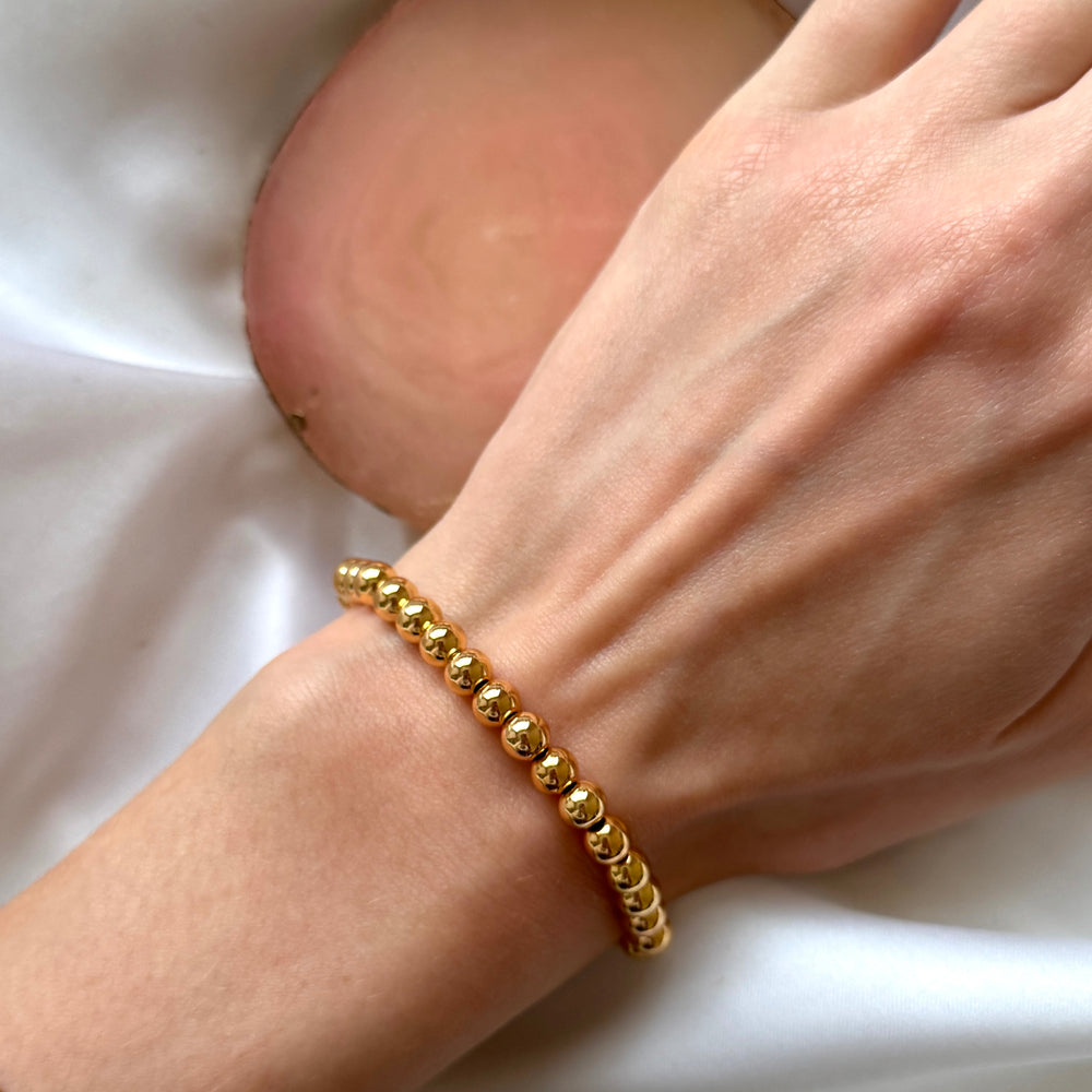 
                      
                        Chunky gold beaded bracelet
                      
                    