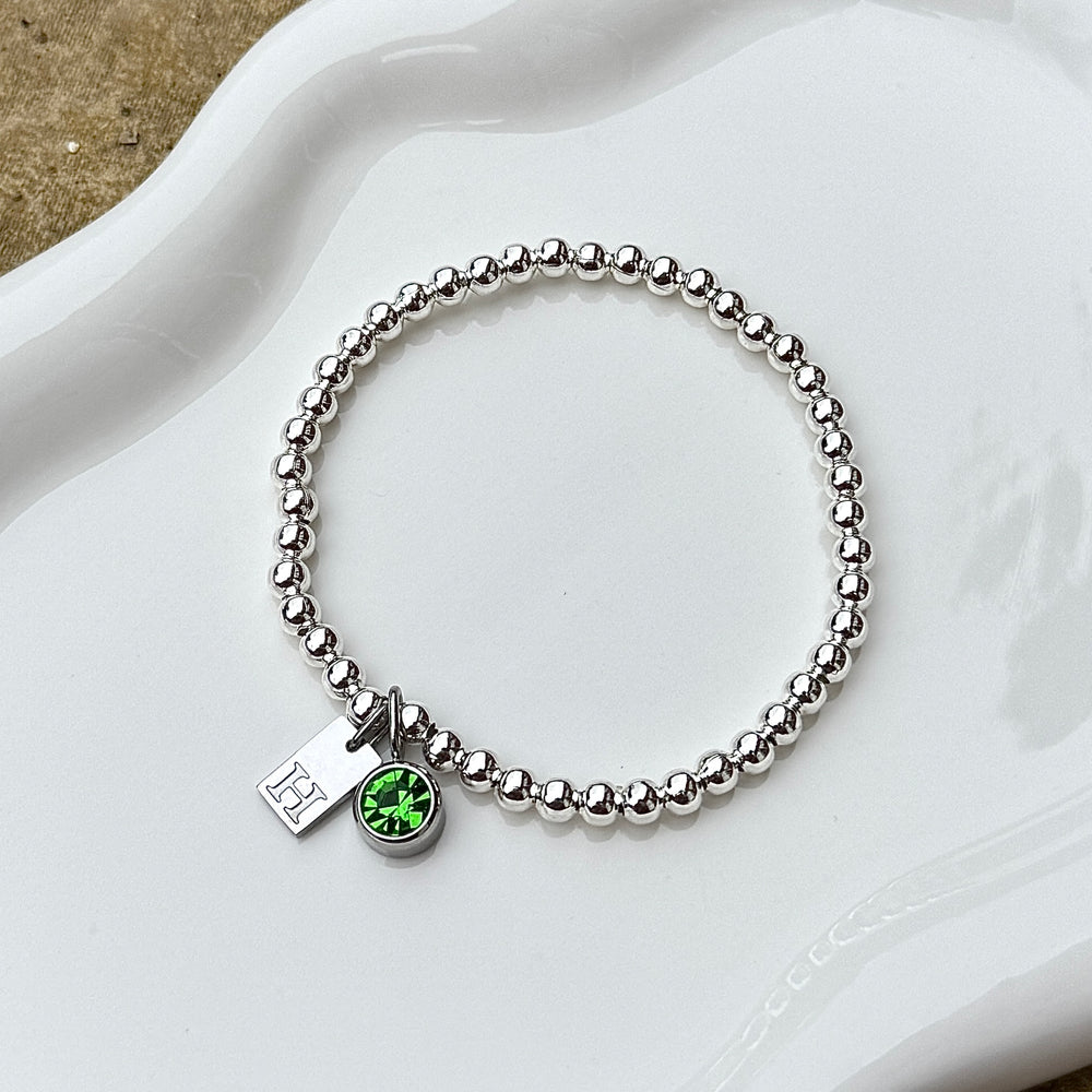 
                      
                        Engraved Initial Birthstone Charm Bracelet - Positively Beaded
                      
                    