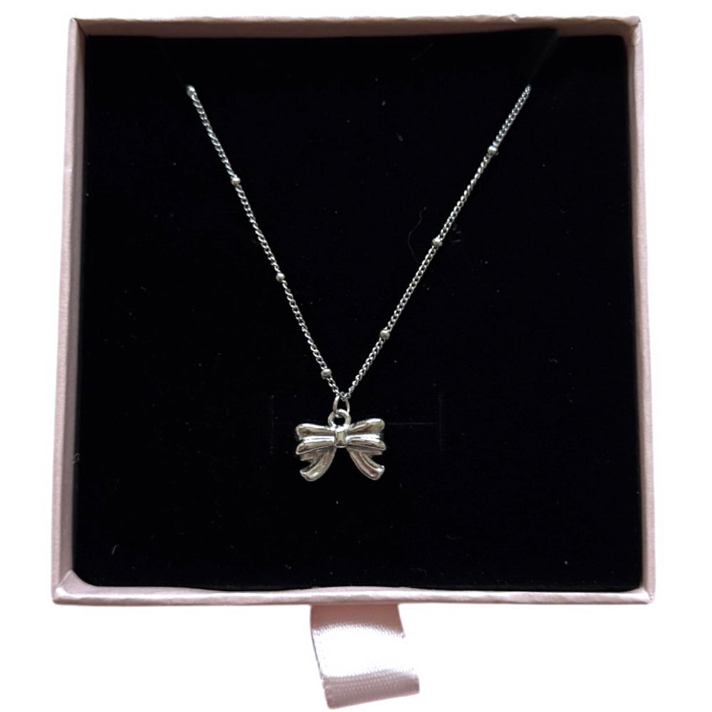 
                      
                        The Clara Bead Chain Bow Necklace
                      
                    