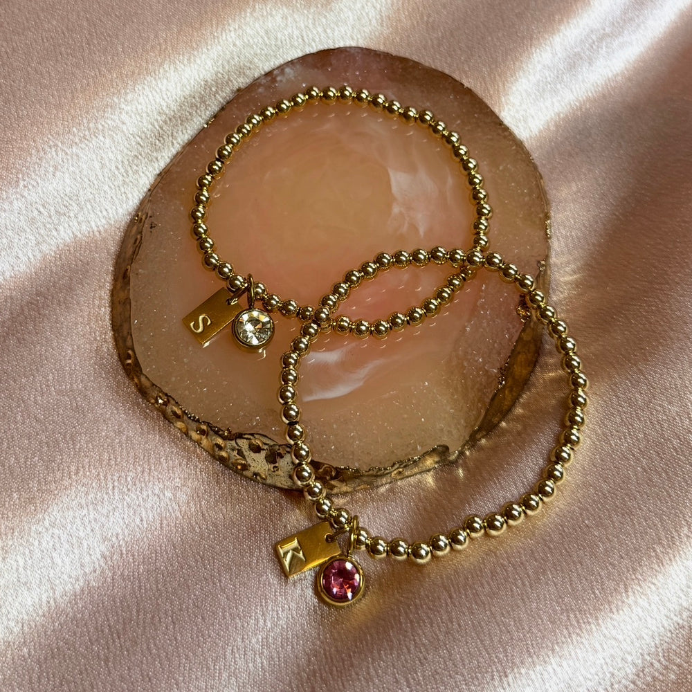 
                      
                        Engraved Initial Birthstone Charm Bracelet - Positively Beaded
                      
                    