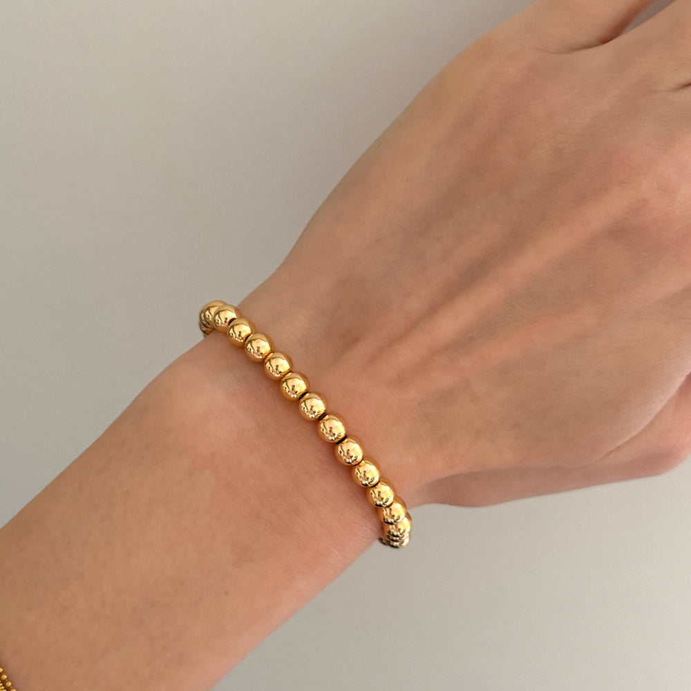 
                      
                        Chunky gold beaded bracelet
                      
                    