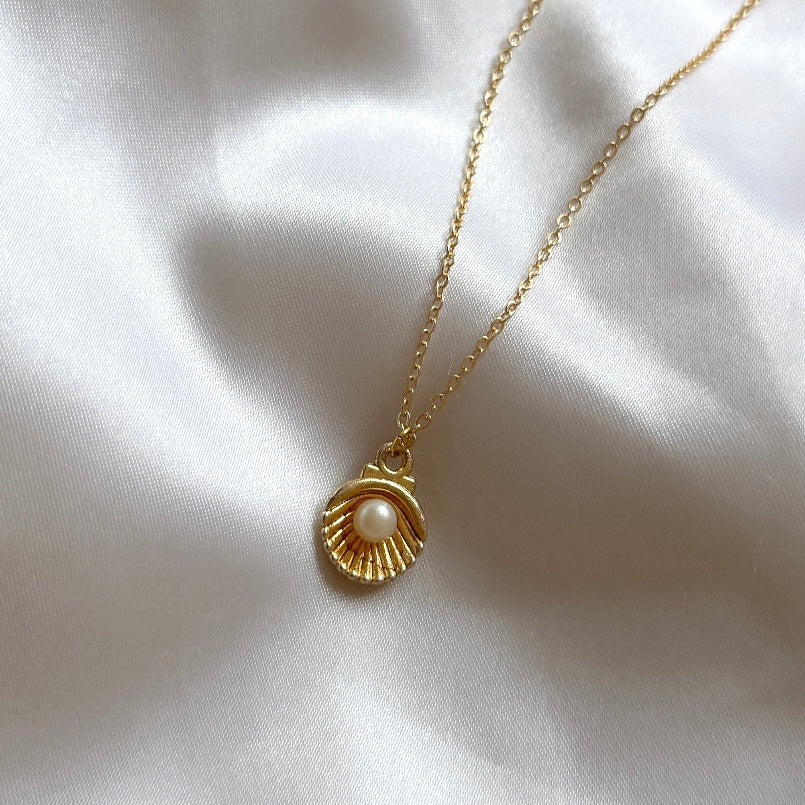 Gold plated oyster charm necklace with pearl detail