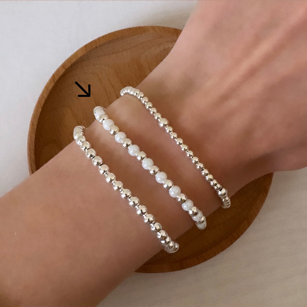 
                      
                        Silver and pearl simple stacking bracelet
                      
                    