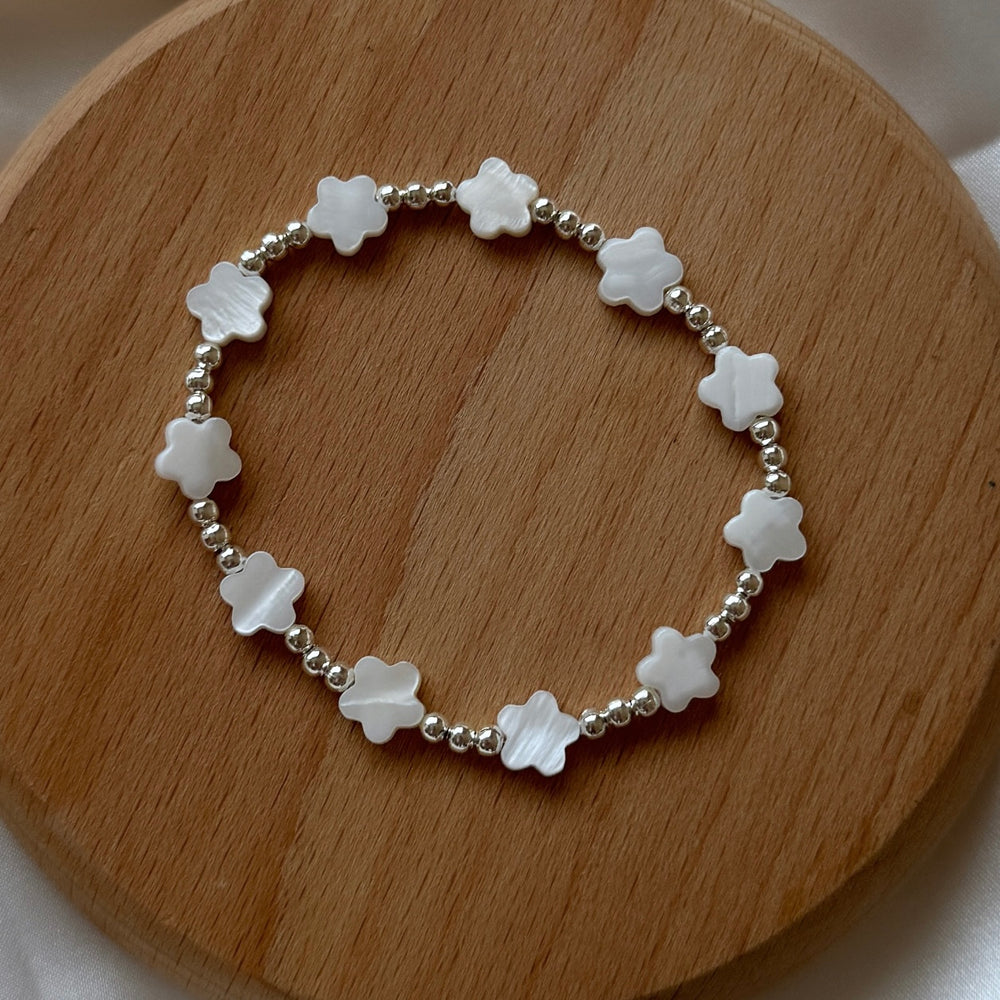 
                      
                        Multi pearl flower 3mm bead bracelet
                      
                    