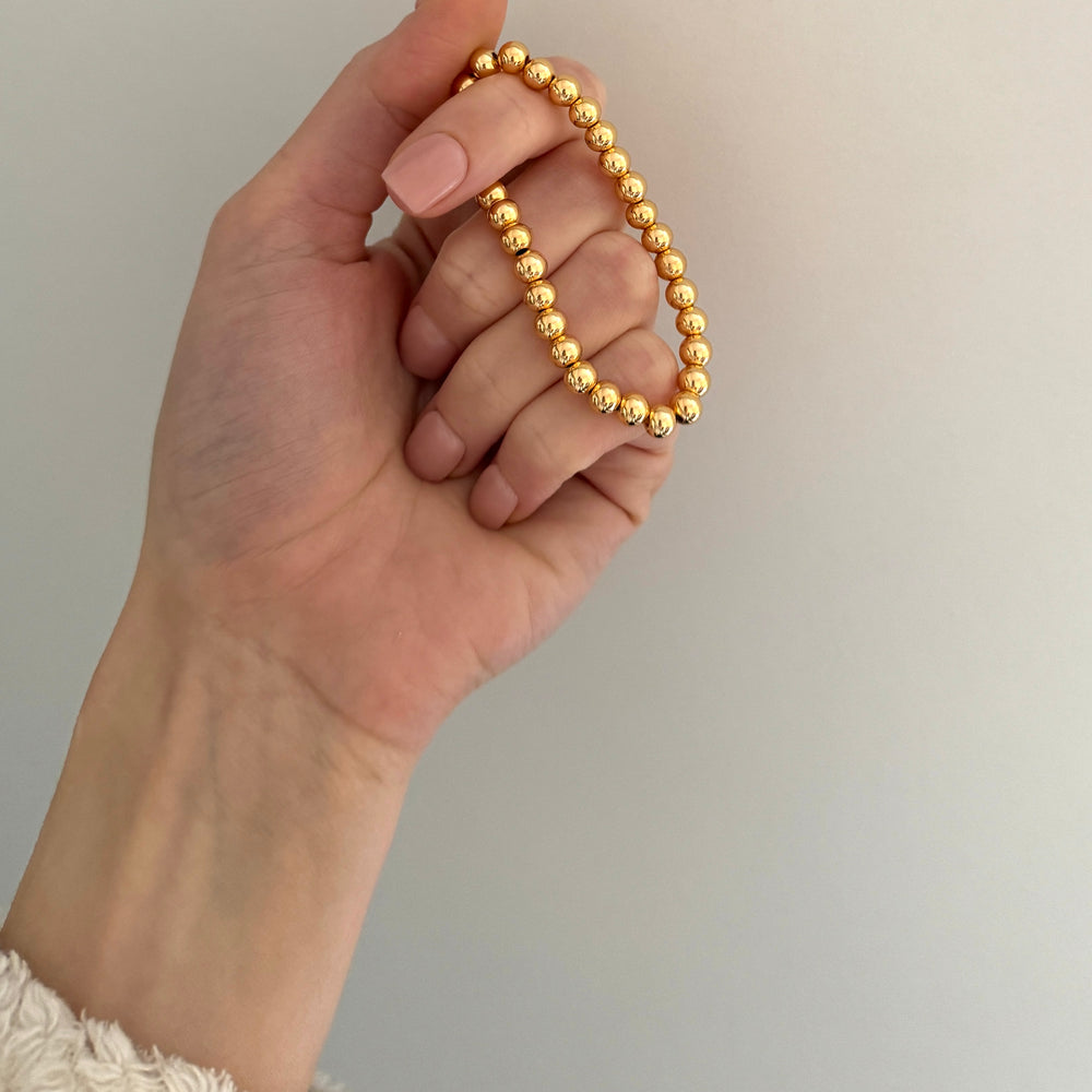 
                      
                        Chunky gold beaded bracelet
                      
                    