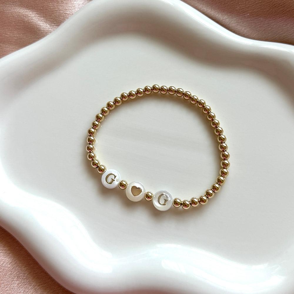 
                      
                        Gold Filled Freshwater Pearl Name Bracelet - Positively Beaded
                      
                    