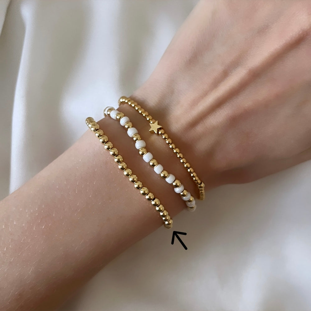 
                      
                        Simple gold beaded bracelet
                      
                    