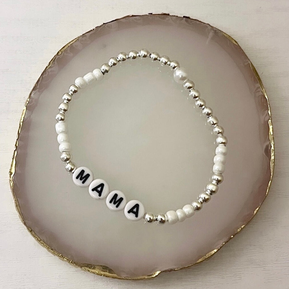 
                      
                        Pearl and silver name bracelet
                      
                    