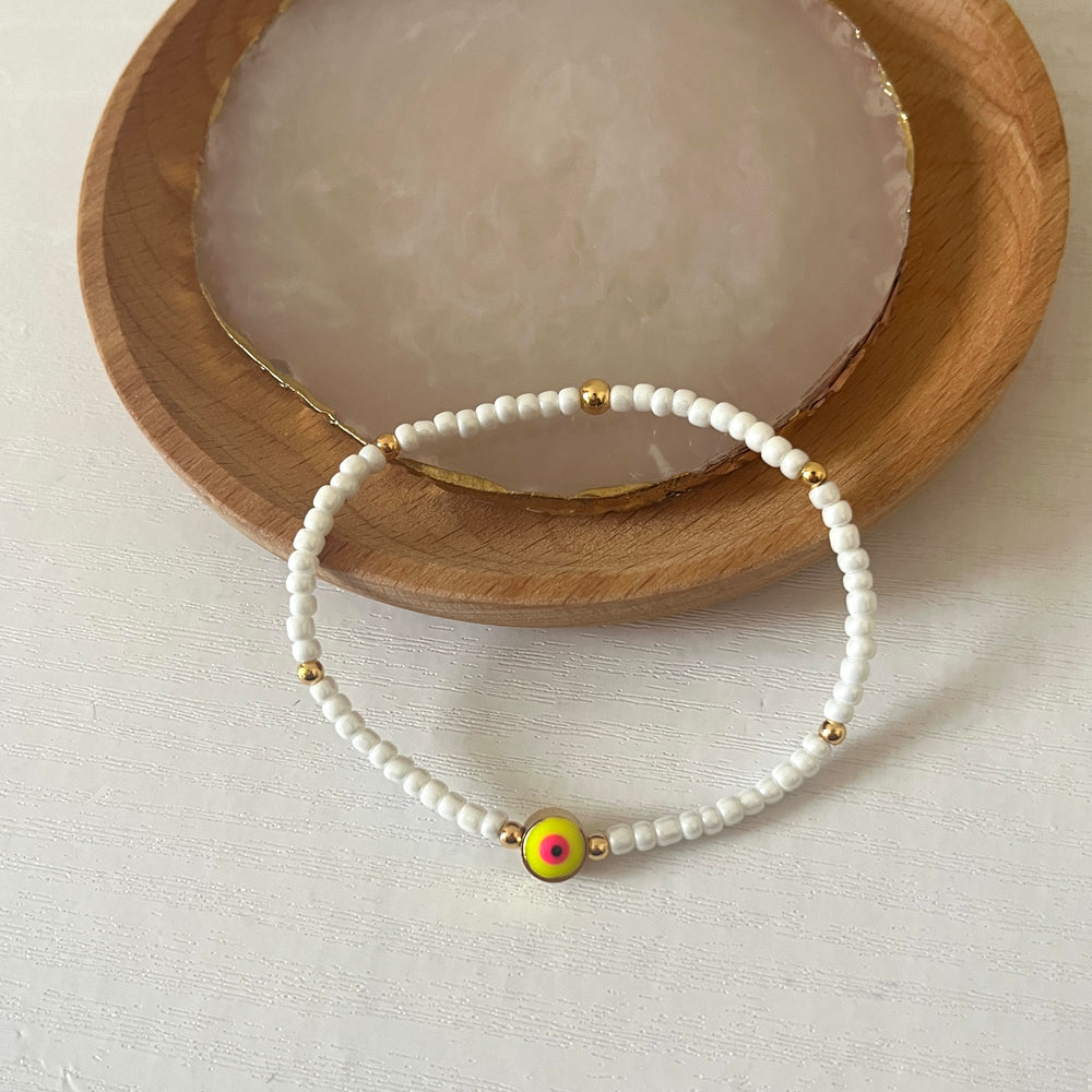 
                      
                        Yellow and pink evil eye stacking bracelet
                      
                    