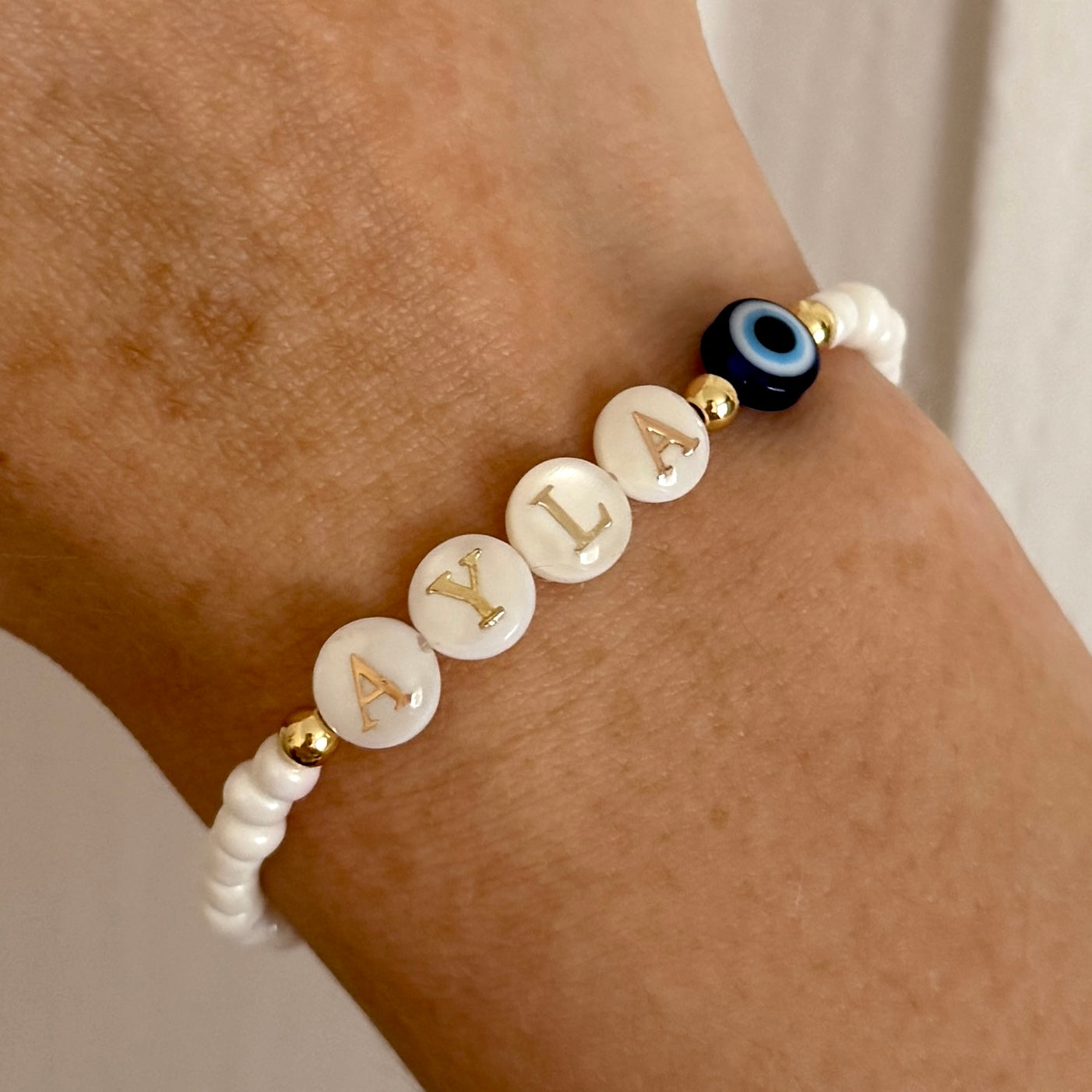 Freshwater pearl evil eye name bracelet - Positively Beaded