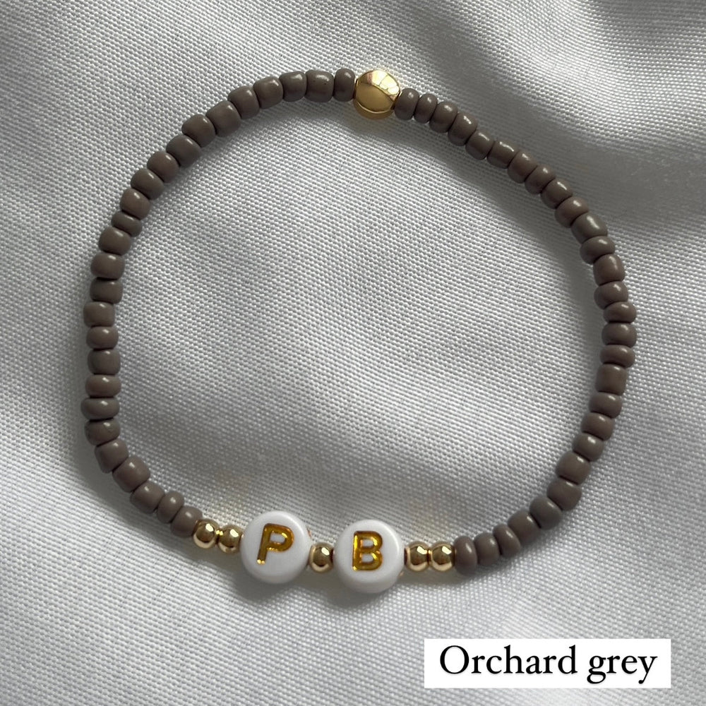 
                      
                        Minimalist neutral initial bracelet - Positively Beaded
                      
                    