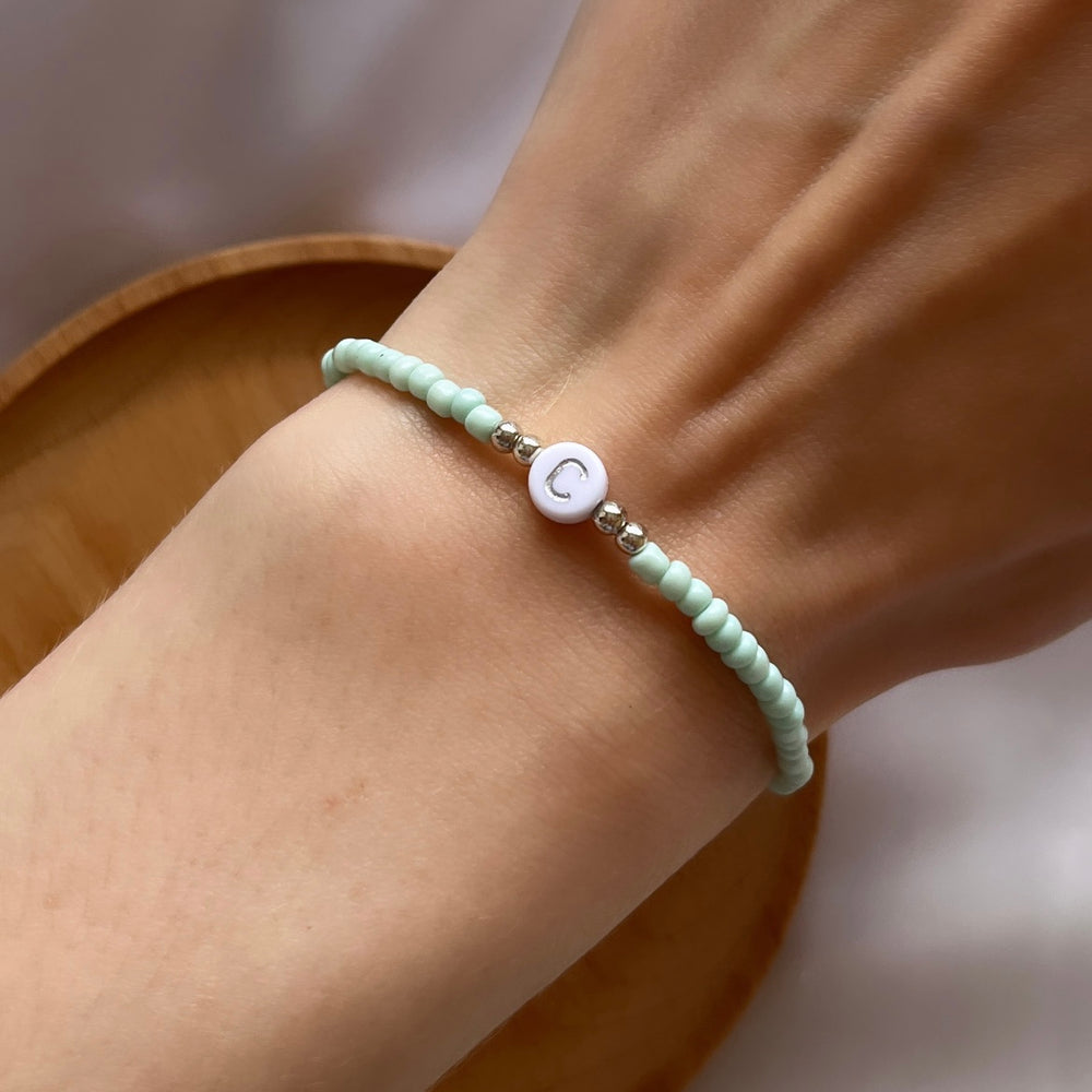 
                      
                        Minimalist neutral initial bracelet - Positively Beaded
                      
                    