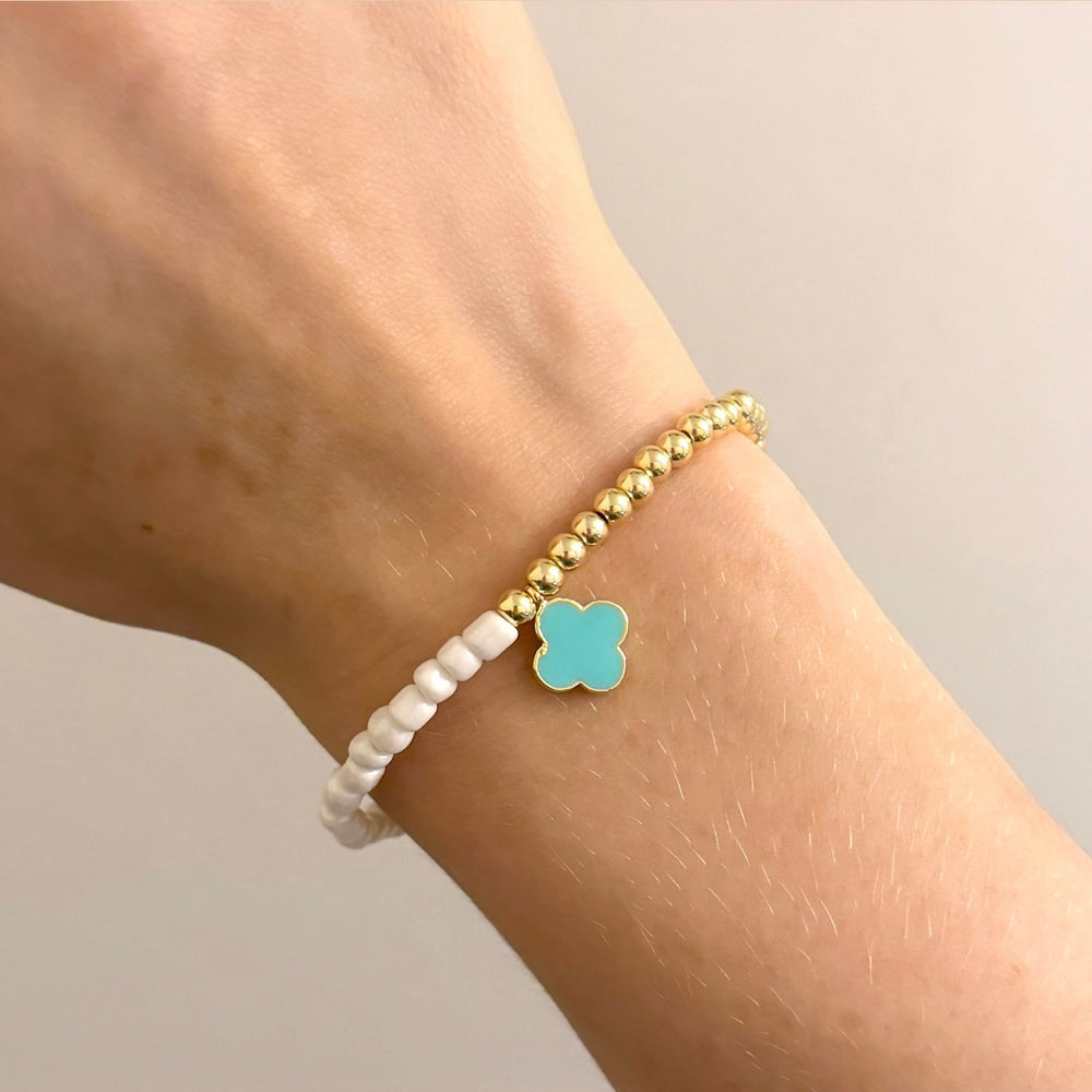 
                      
                        Pearl and gold four leaf clover bracelet
                      
                    