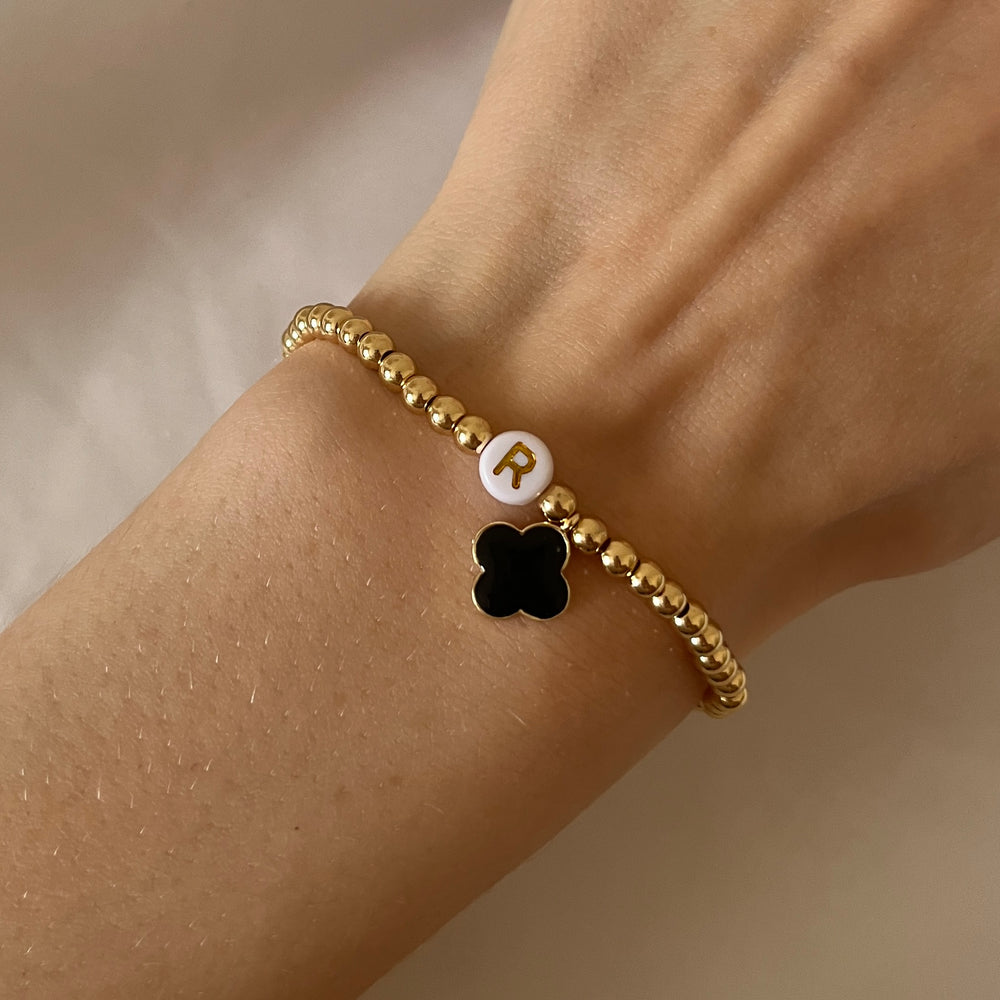 
                      
                        Gold clover charm initial bracelet
                      
                    