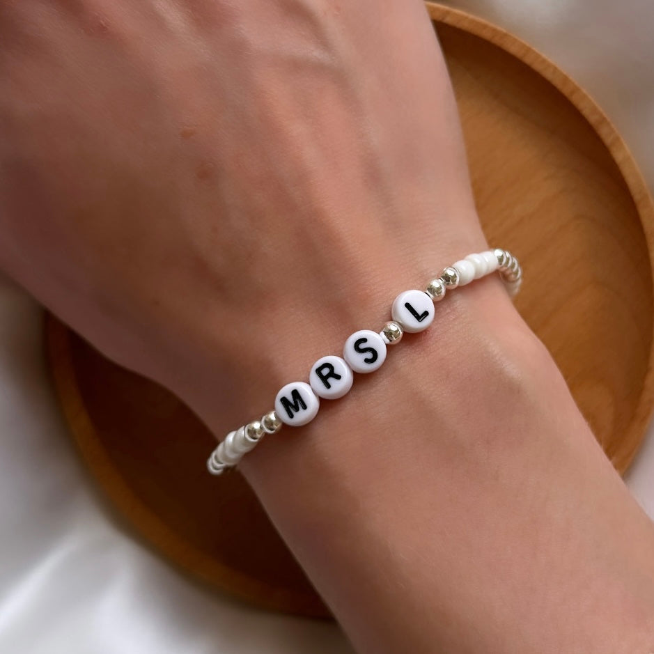 Pearl and silver name bracelet