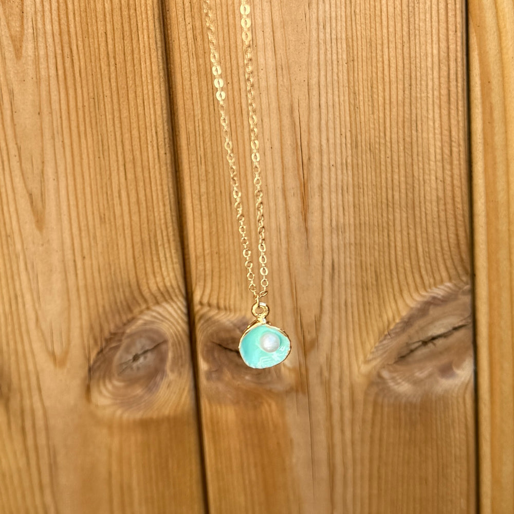 
                      
                        Gold plated oyster charm necklace - turquoise
                      
                    