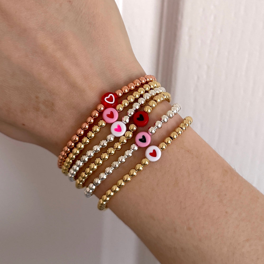 
                      
                        Luxe mix and match pink themed heart stacking bracelets
                      
                    