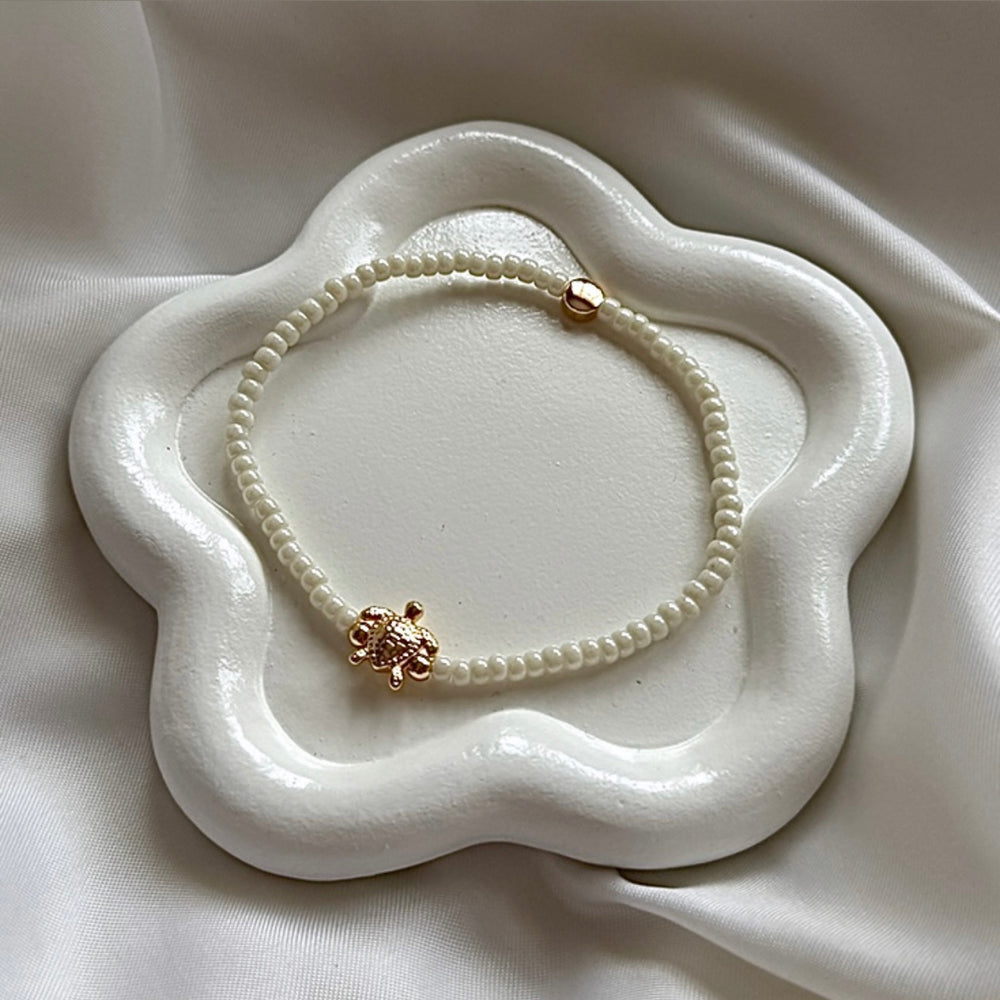 Delicate gold plated turtle charm stacking bracelet