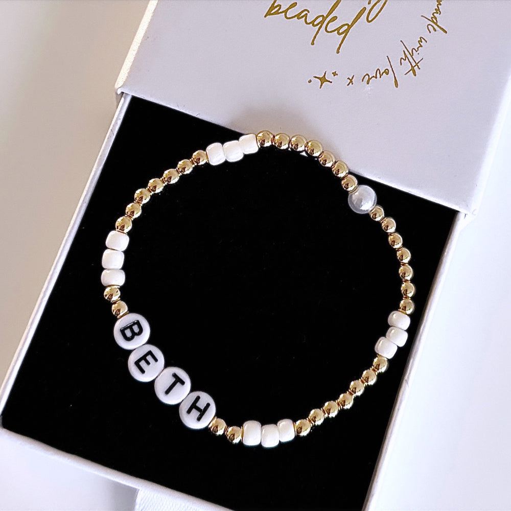 
                      
                        Pearl and gold name bracelet - Positively Beaded
                      
                    