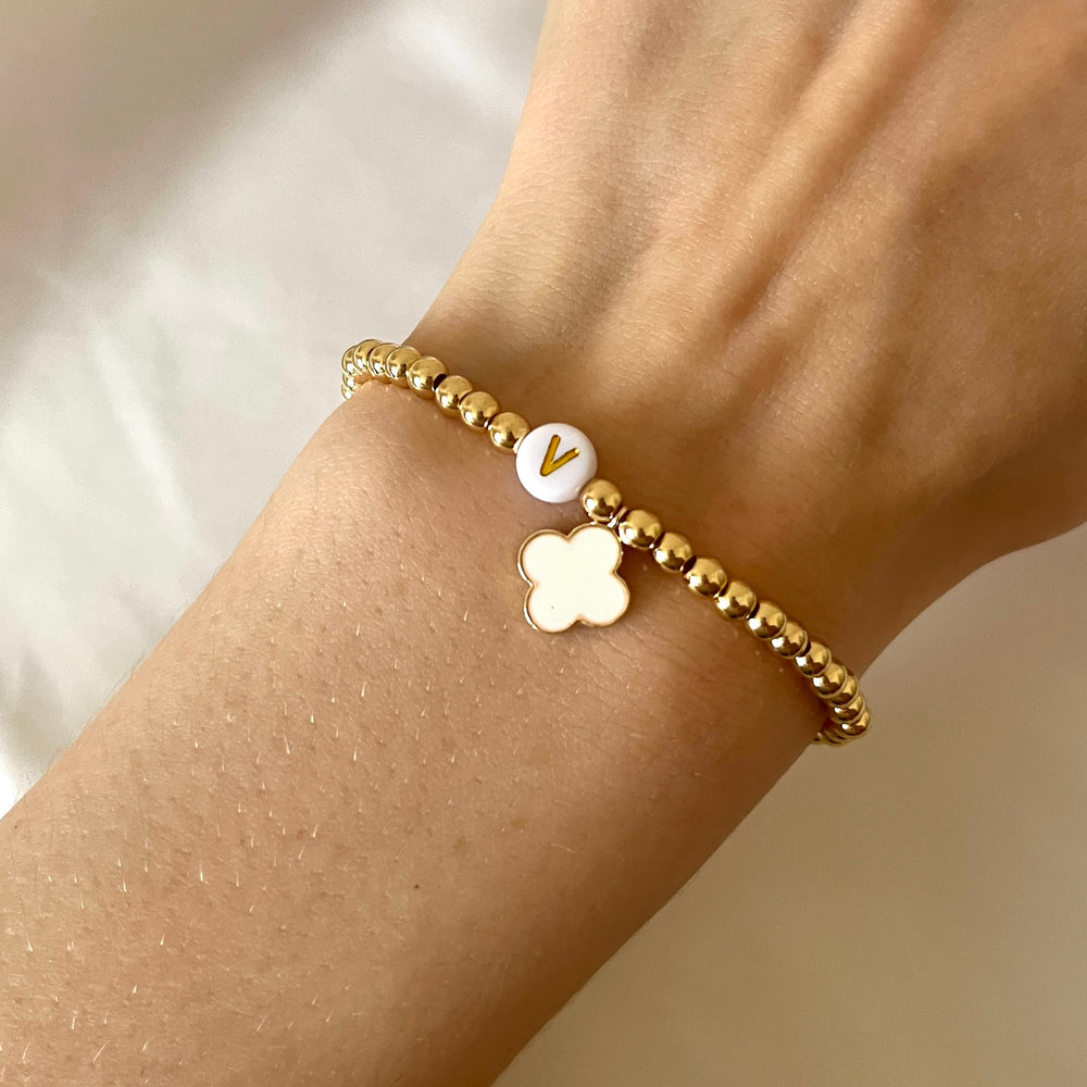 
                      
                        Gold clover charm initial bracelet
                      
                    