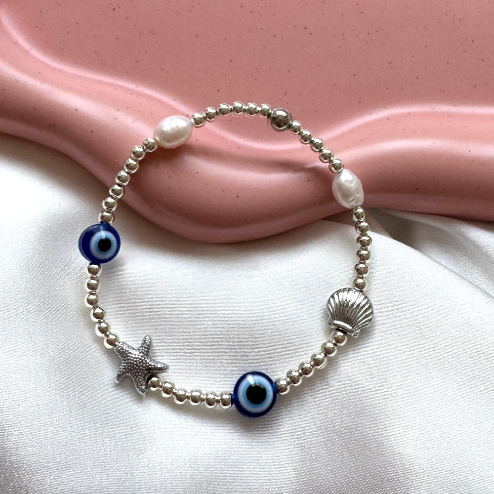 
                      
                        Eclectic evil eye shell bracelet - Positively Beaded
                      
                    