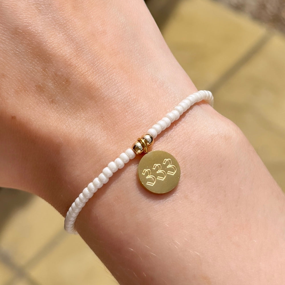 
                      
                        Pearl Lustre Angel Number Charm Bracelet - Positively Beaded
                      
                    