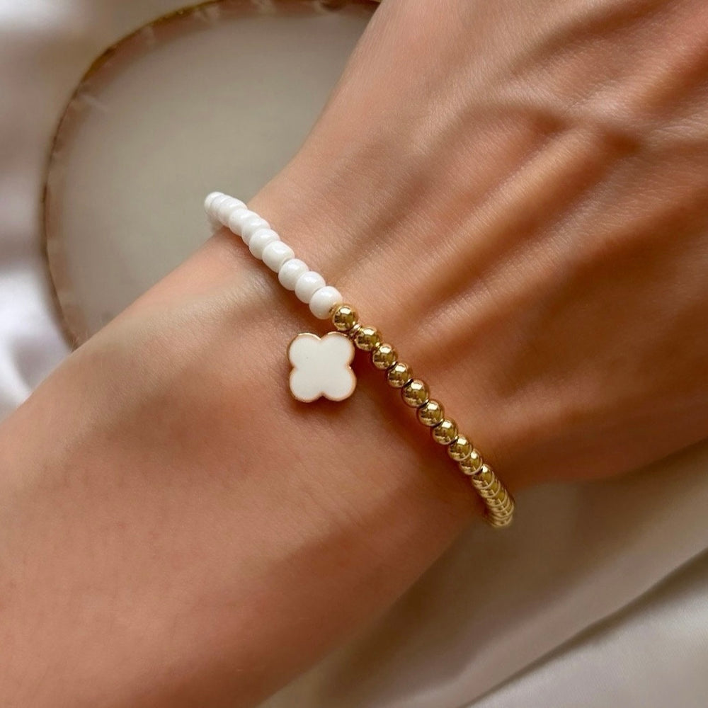 
                      
                        Pearl and gold four leaf clover bracelet
                      
                    