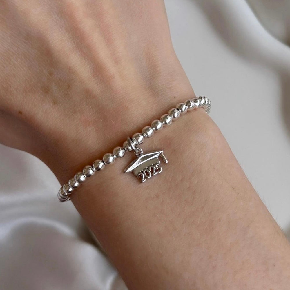 
                      
                        2025 Graduation Cap Charm Bracelet - Positively Beaded
                      
                    