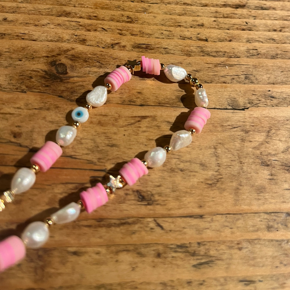 
                      
                        Beaded phone strap - heishi pearl
                      
                    