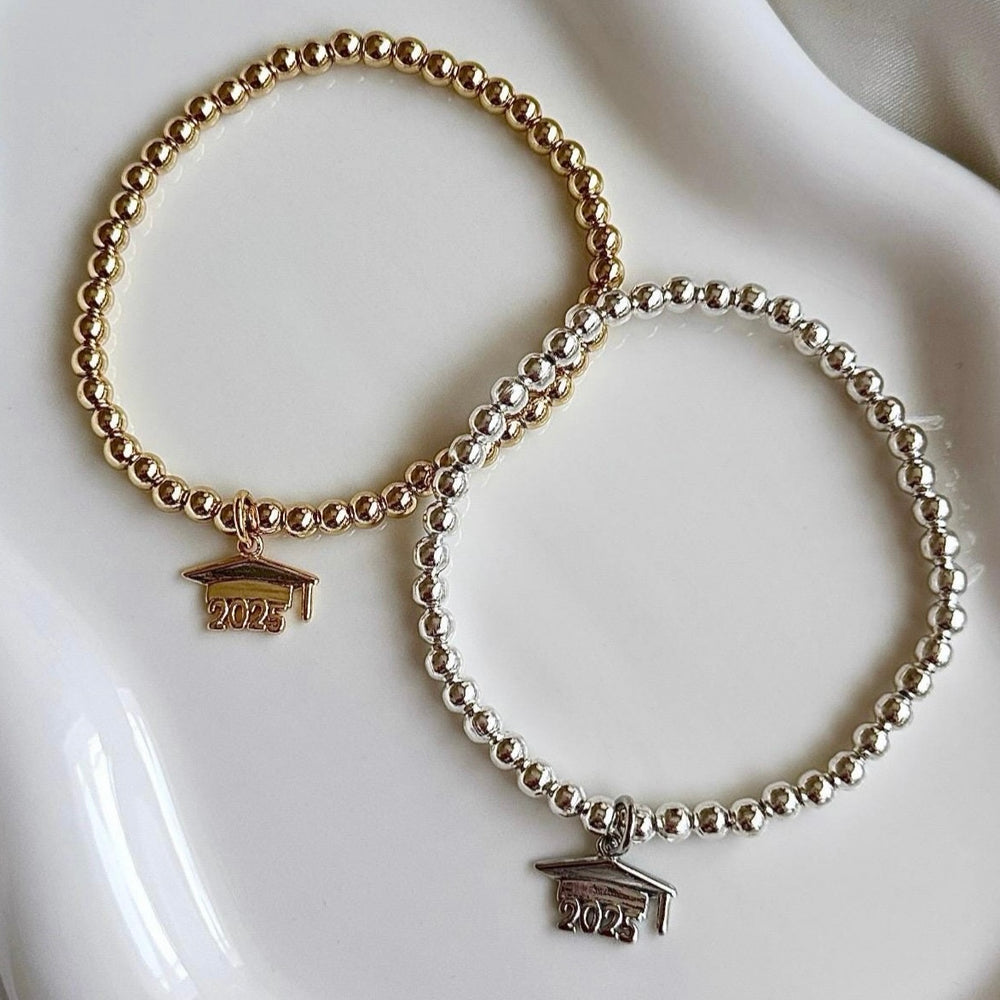 
                      
                        2025 Graduation Cap Charm Bracelet - Positively Beaded
                      
                    