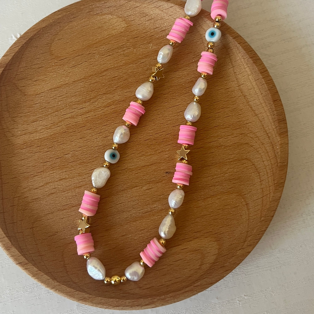 
                      
                        Beaded phone strap - heishi pearl
                      
                    