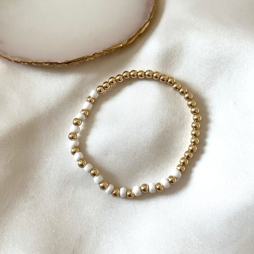 
                      
                        Gold and pearl simple stacking bracelet
                      
                    