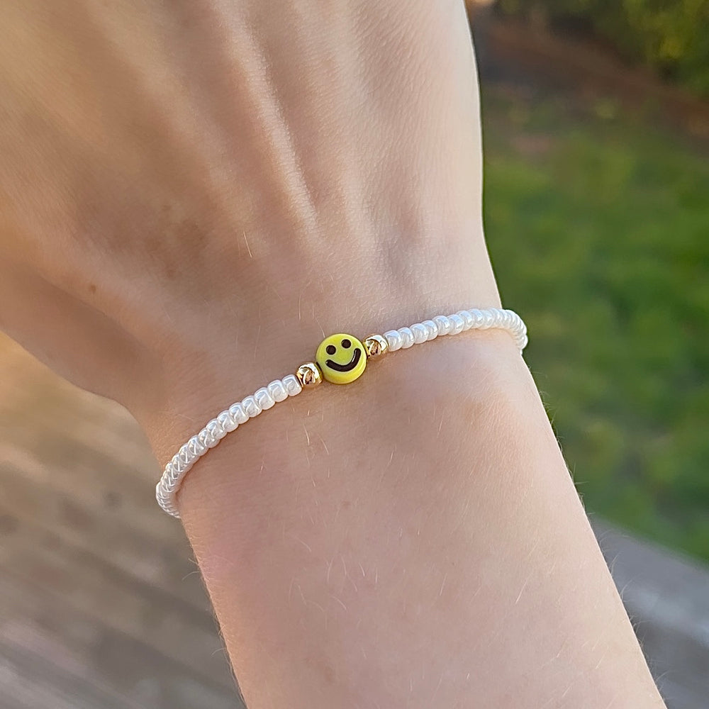 
                      
                        Yellow smiley stacking bracelet
                      
                    