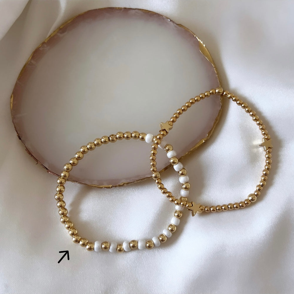 
                      
                        Gold and pearl simple stacking bracelet
                      
                    