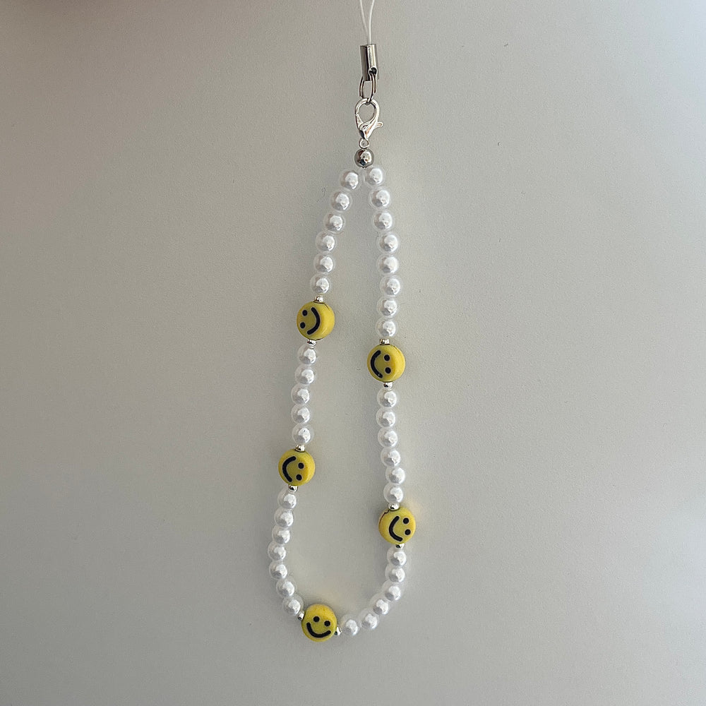 
                      
                        Beaded phone strap - smile and pearl
                      
                    