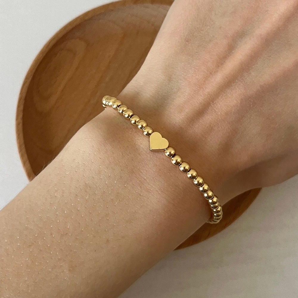 
                      
                        Simple gold heart bracelet
                      
                    