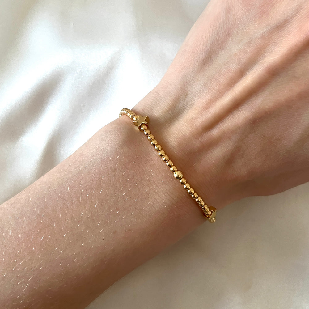 
                      
                        Gold star beaded bracelet
                      
                    