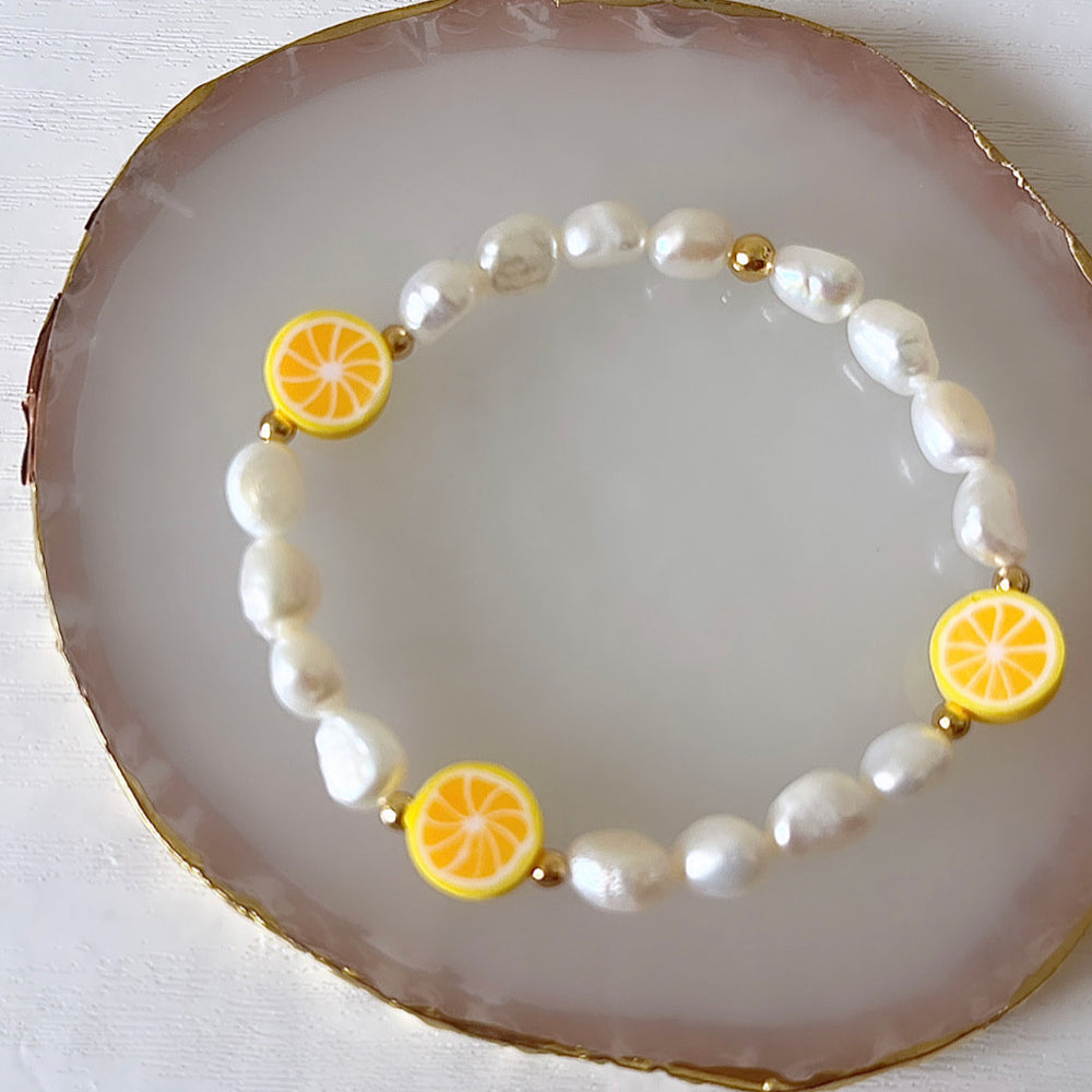 
                      
                        Lemon pearl bracelet
                      
                    