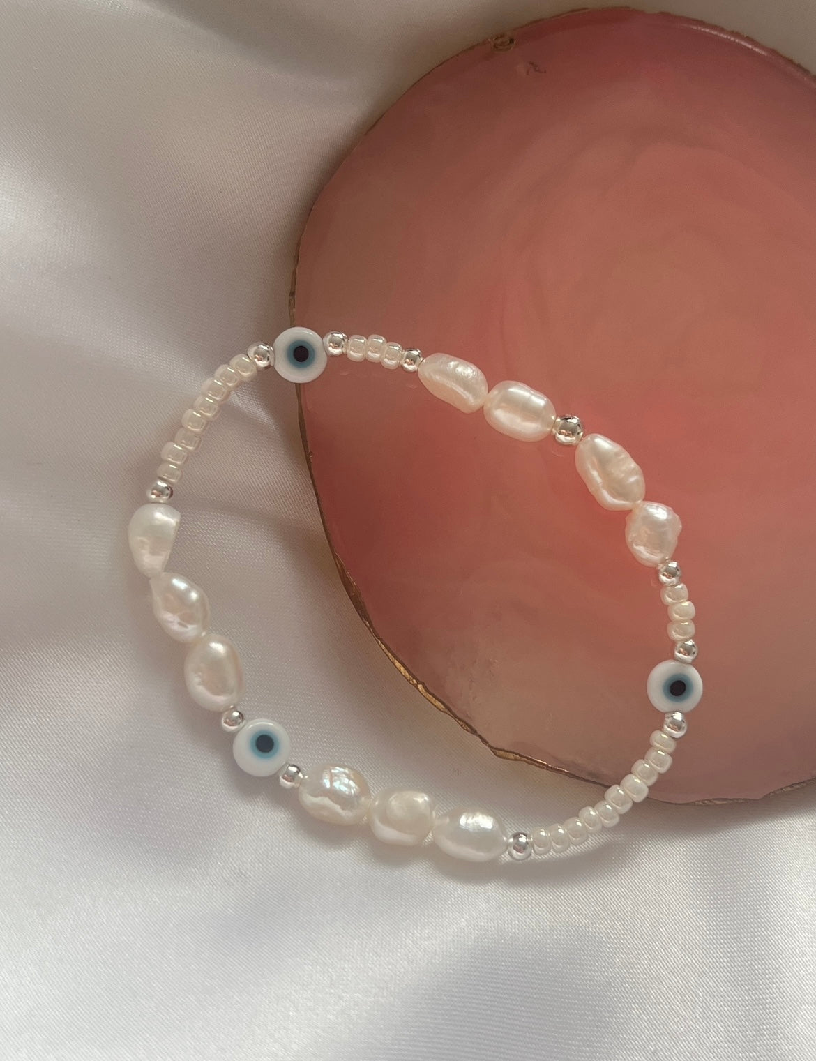 Light blue evil eye and pearl bracelet