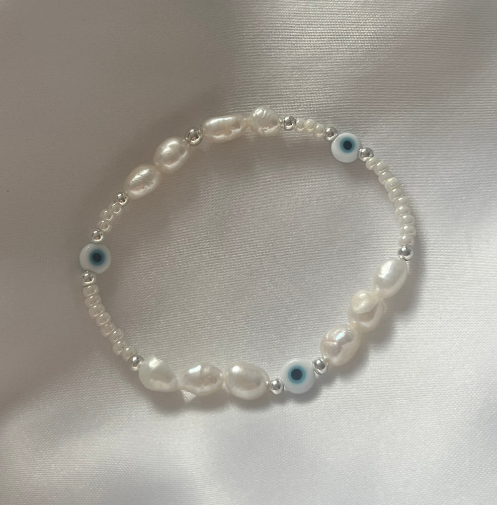 Light blue evil eye and pearl bracelet