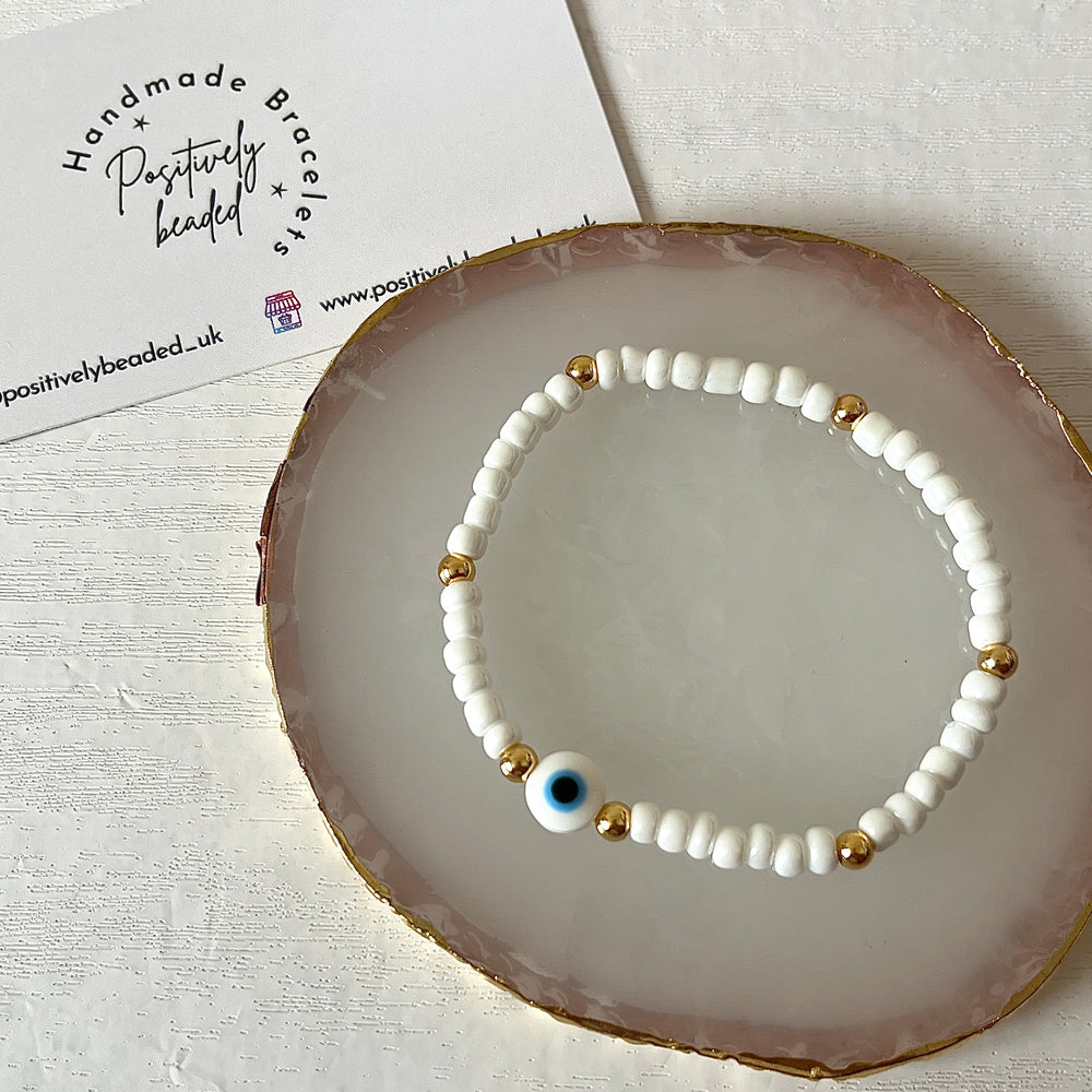 
                      
                        White evil eye bracelet
                      
                    