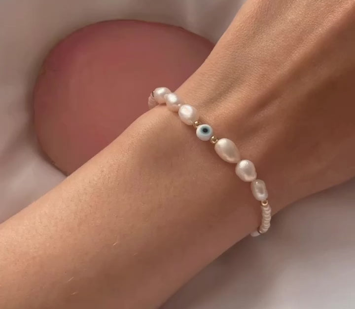 
                      
                        Load and play video in Gallery viewer, Light blue evil eye and pearl bracelet
                      
                    