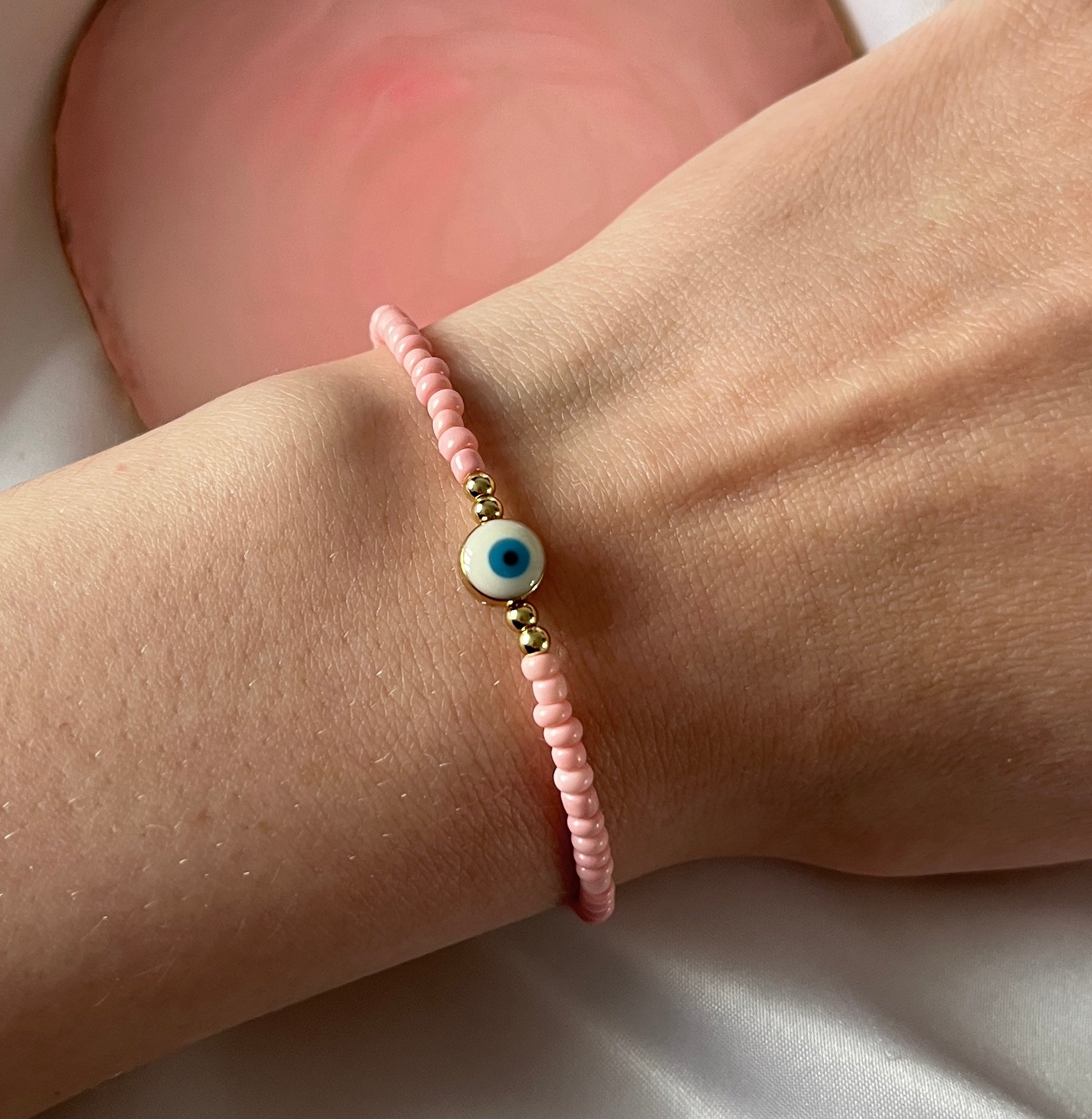 Pink evil eye deals bracelet